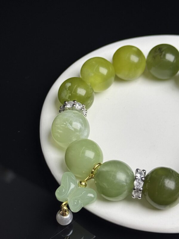 _cgi-bin_mmwebwx-bin_webwxgetmsgimg__&MsgID=4760459974861104152&skey=@crypt_5d9f2d0d_b0b44d49714aa20364262728dbab7d6d&mmweb_appid=wx_webfilehelper Green Gemstone Bracelet with Butterfly Charm – Symbol of Renewal, Healing & Inner Harmony