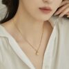 fc52bdbb9357f0f00b3da23ca437dcb5 Aurora Pearl Titanium Necklace